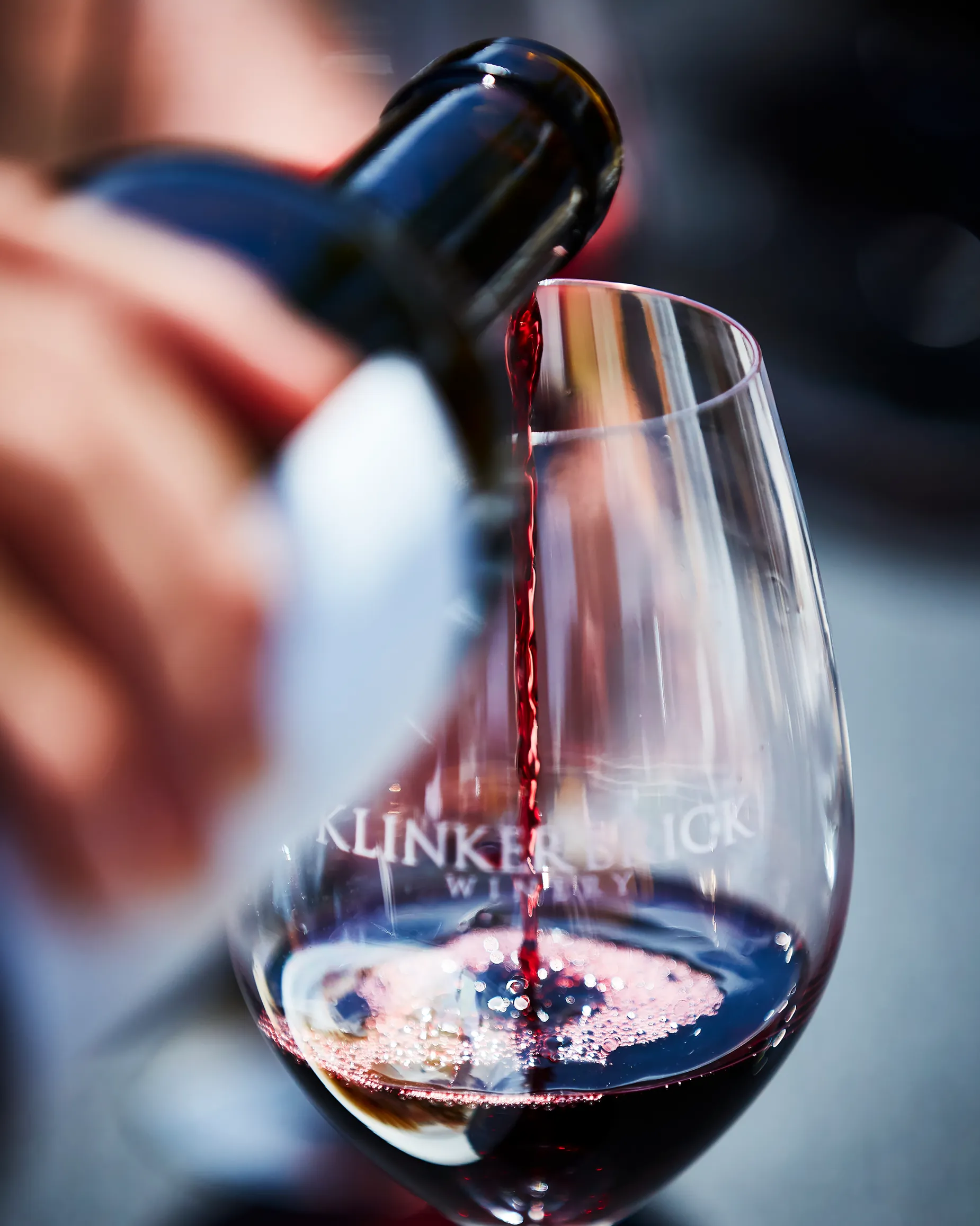 Wine being poured into a Klinker Brick wine glass
